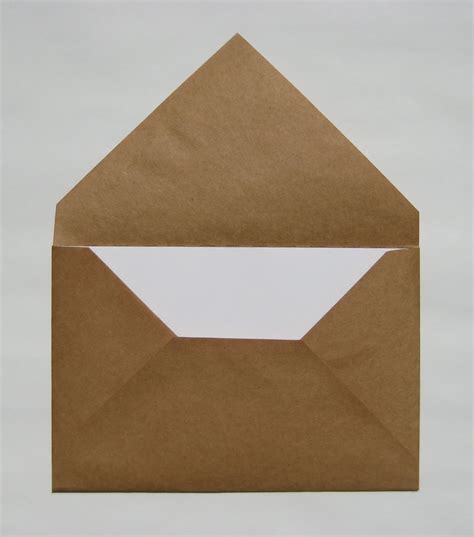 How to make an envelope out of paper - Unfold the paper. Make sure your card is centered on the paper, then fold the right. side of the paper over the card. Repeat with the left side of the paper. Unfold the paper, then use the creases as guidelines to cut away. the top two smaller corners. Fold in the sides of the paper, then place a stripe of glue along.